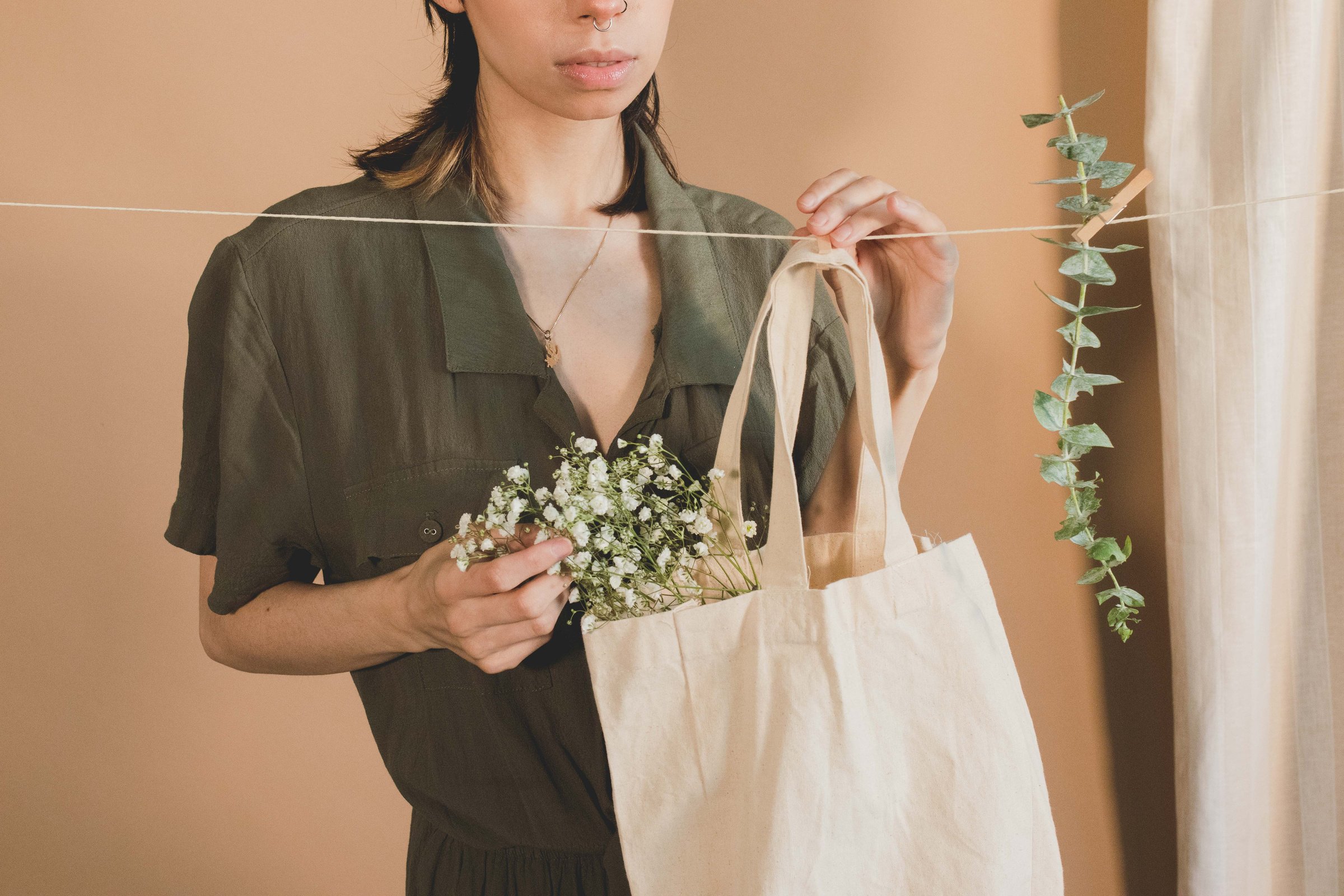 Woman Holding Tote Bag with Baby's Breath